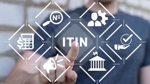 A man pressing a button that says "ITIN"