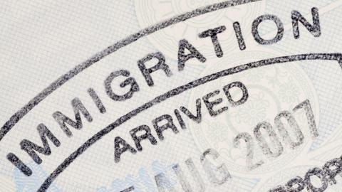 A close-up view of a visa stamp in a passport