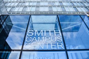A modern building with "Smith Campus Center" written in large letters on a glass atrium