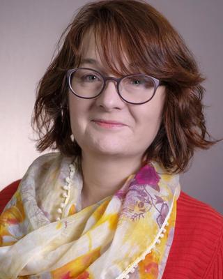 Headshot of Ivana Hrga-Griggs